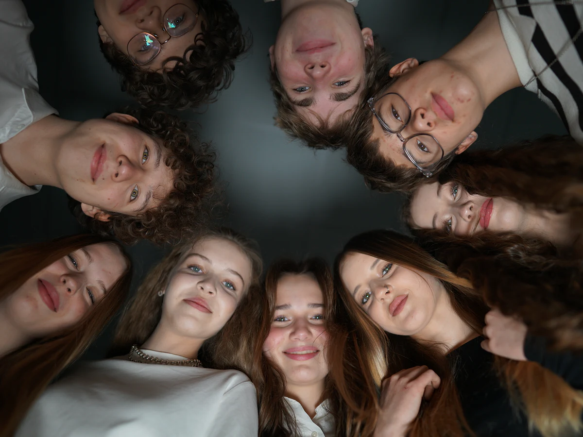 Kyiv Lyceum of Business students gathered around the camera